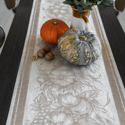 Autumn Harvest Table Runner on the table with pumpkins and Olives